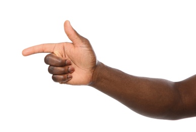 African-American man pointing at something on white background, closeup