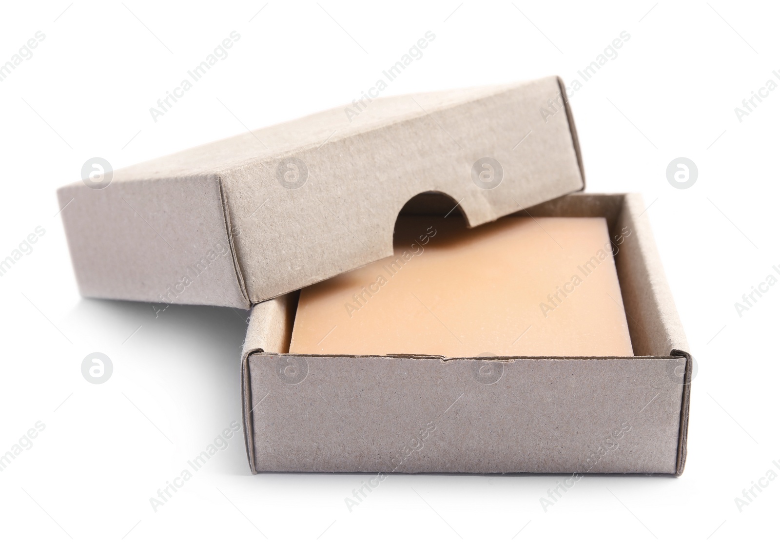 Photo of Hand made soap bar in cardboard package on white background