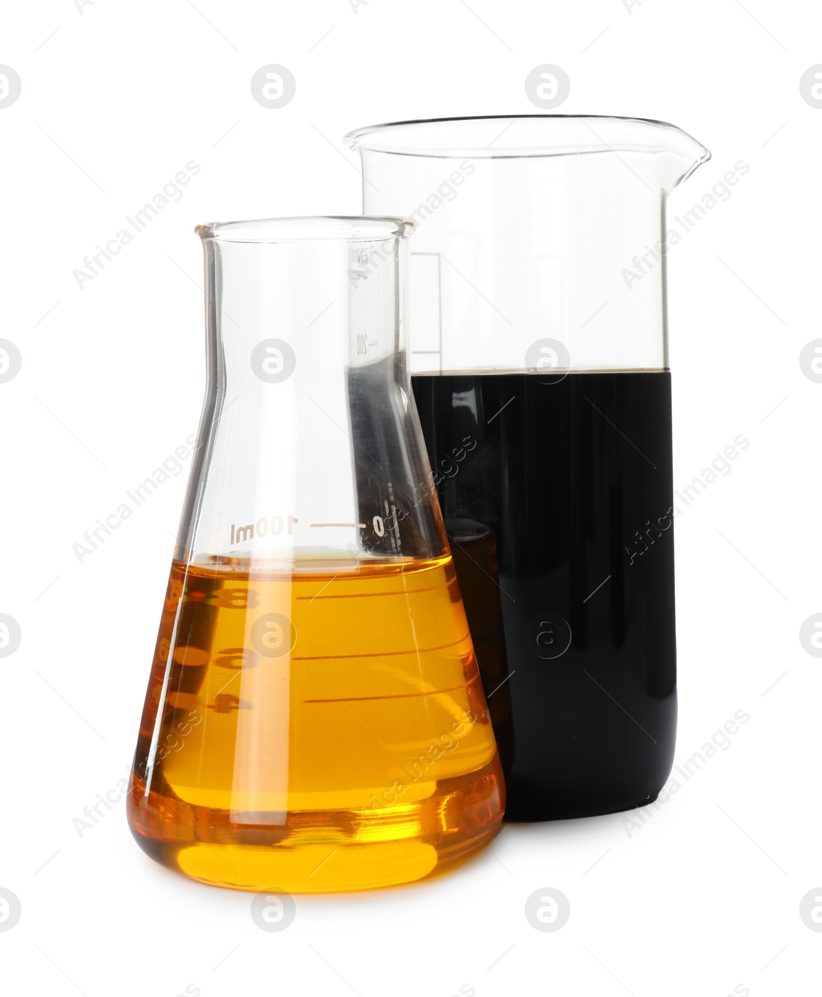 Photo of Beaker and flask with different types of crude oil isolated on white