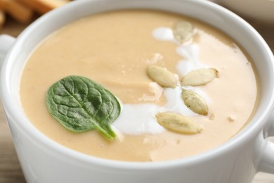 Photo of Healthy cream soup high in vegetable fats in bowl, closeup