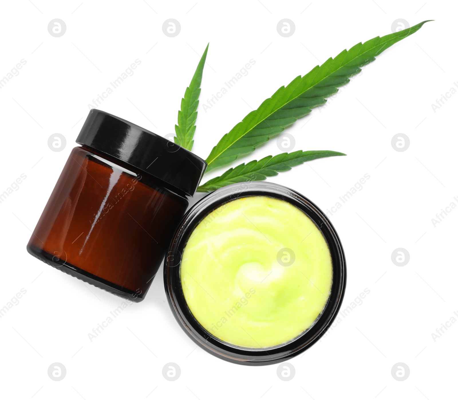 Photo of Jars with hemp cream and green leaf on white background, top view. Natural cosmetics