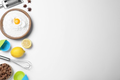 Photo of Cooking utensils and ingredients on light background, flat lay. Space for text