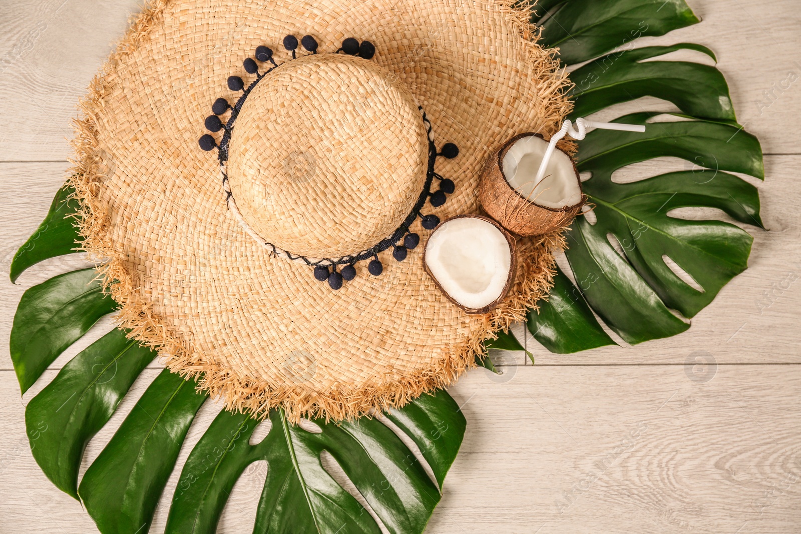 Photo of Flat lay composition with bamboo hat on wooden background