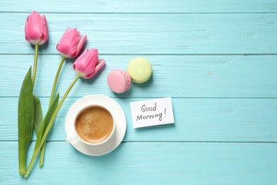 Photo of Flat lay composition with message GOOD MORNING and coffee on light blue wooden table. Space for text