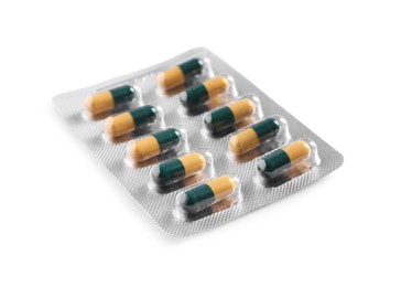 Photo of Blister of pills on white background. Medicinal treatment