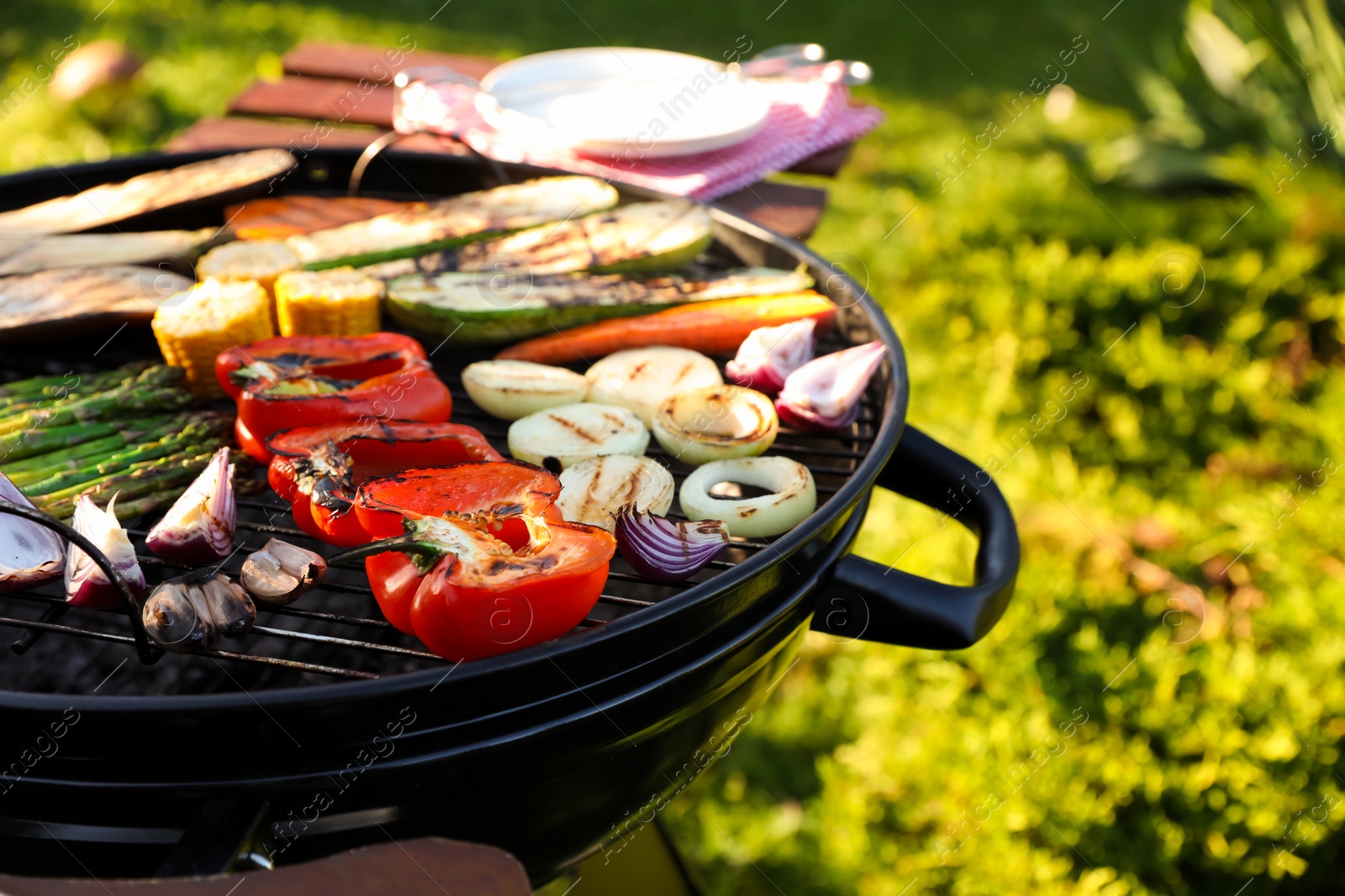 Photo of Delicious grilled vegetables on barbecue grill outdoors