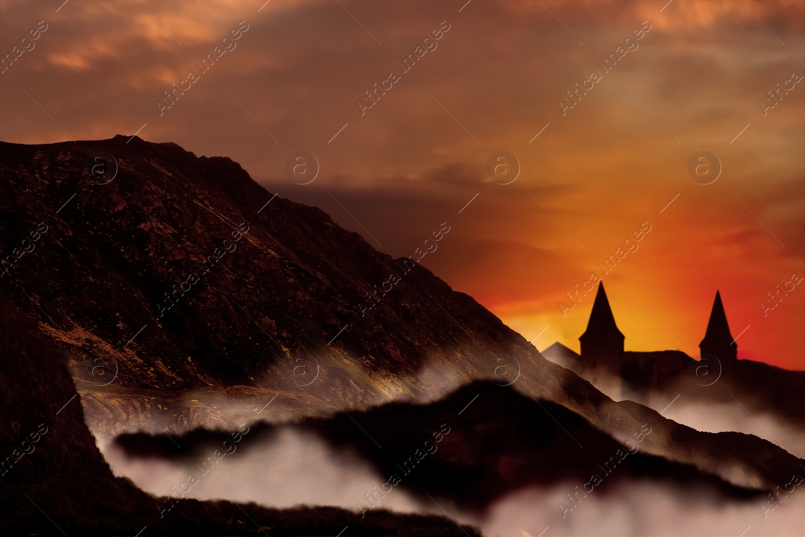 Image of Fantasy world. Mystical castle and mountains covering with fog in night