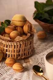 Walnut shaped cookies and mint on table. Homemade pastry filled with caramelized condensed milk