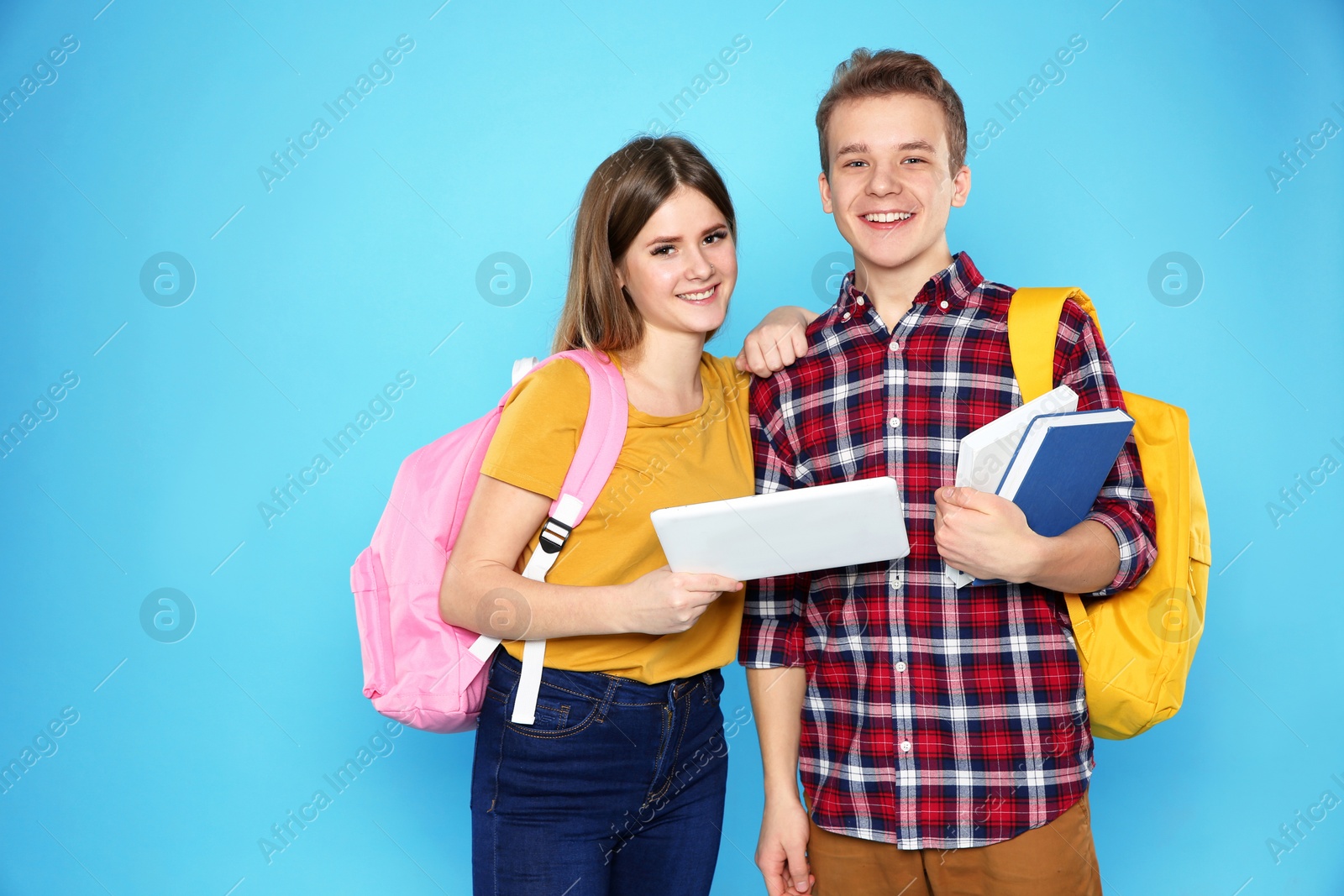 Photo of Happy teenagers on color background. Youth lifestyle and friendship