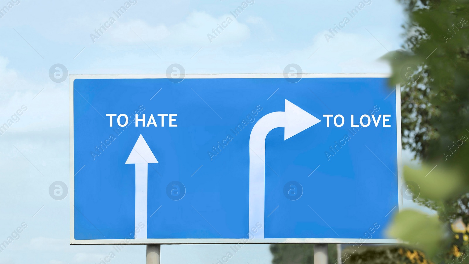 Image of Road sign with different directions - TO HATE or TO LOVE outdoors