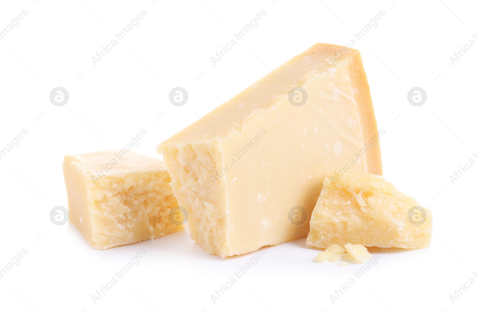 Photo of Pieces of delicious parmesan cheese on white background