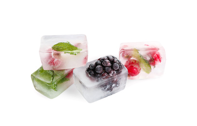 Photo of Ice cubes with berries and mint on white background