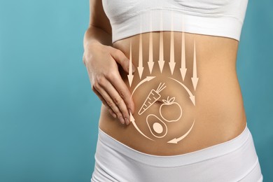 Healthy digestion. Woman touching her belly against light blue background, closeup. Illustration of arrows and different products on her body