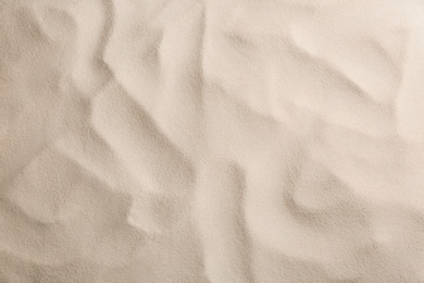 Photo of Dry beach sand as background, top view