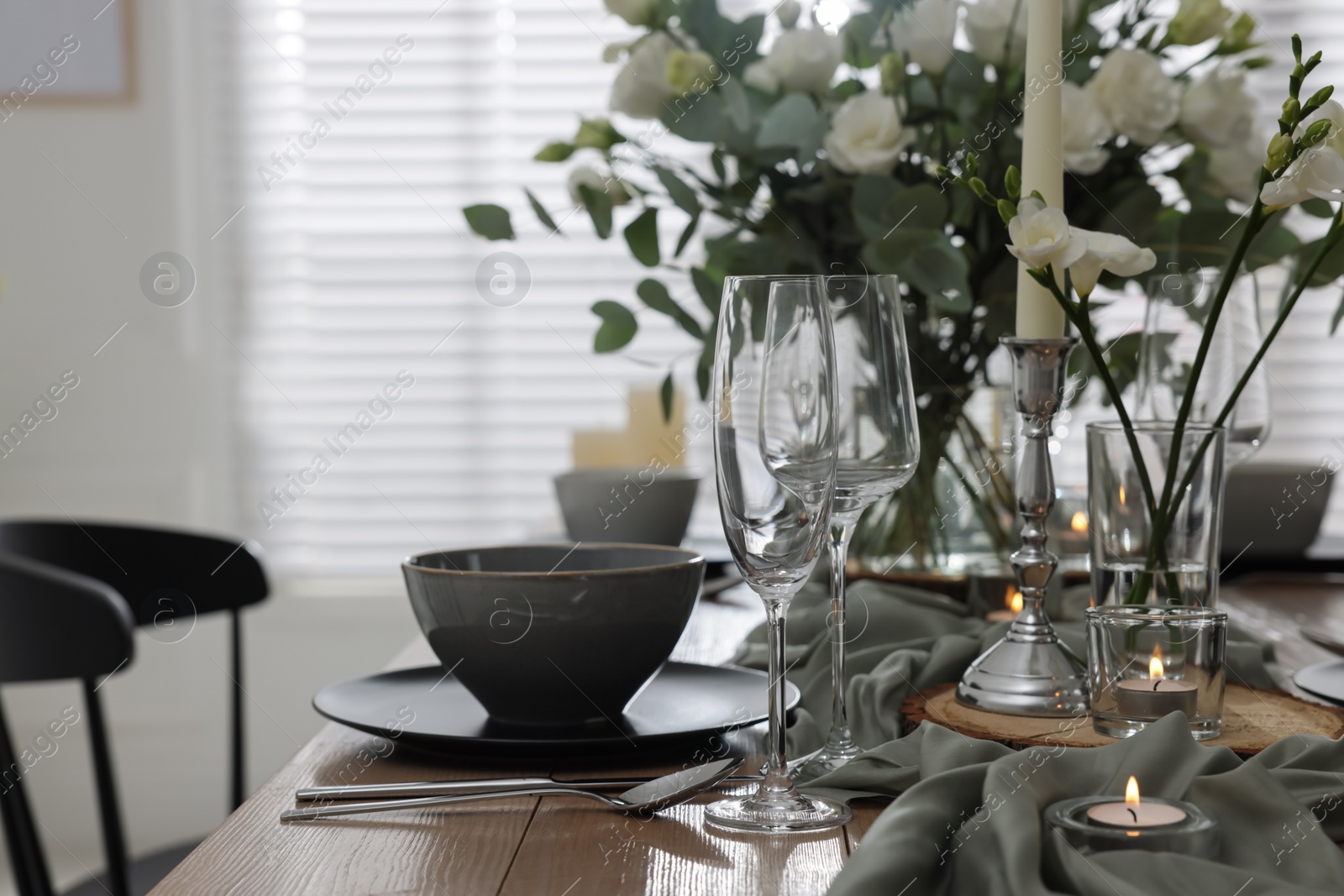 Photo of Festive table setting with beautiful tableware and decor indoors