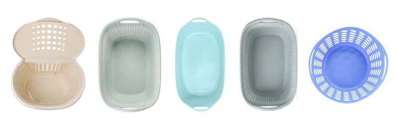 Image of Different laundry baskets on white background, top view. Banner design