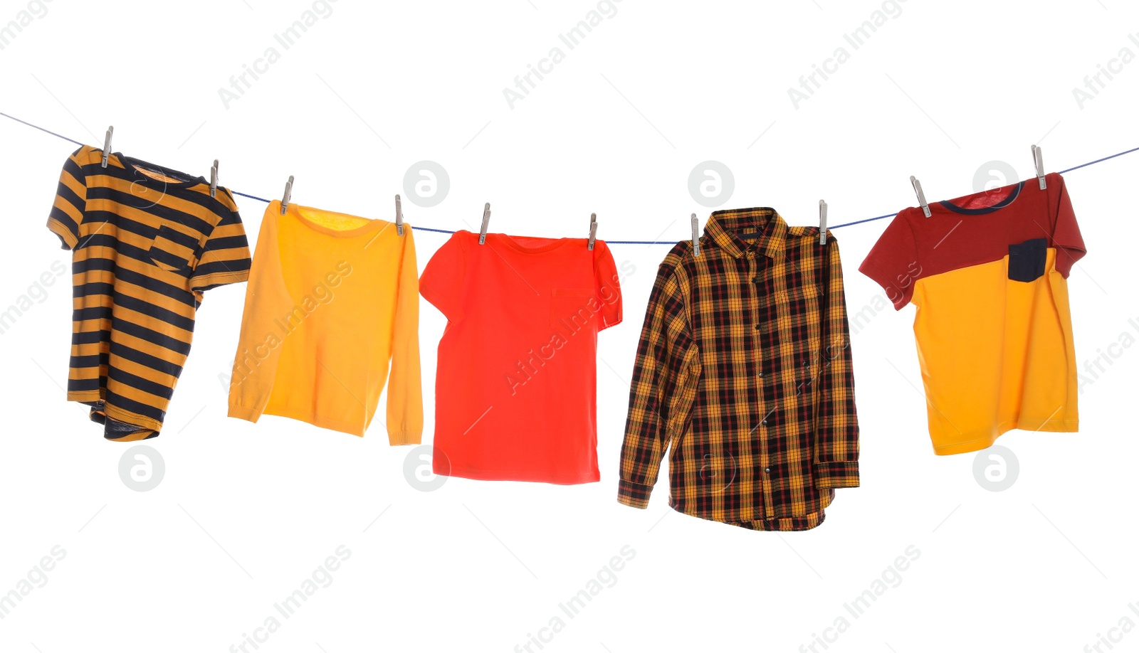 Photo of Different bright clothes drying on washing line against white background