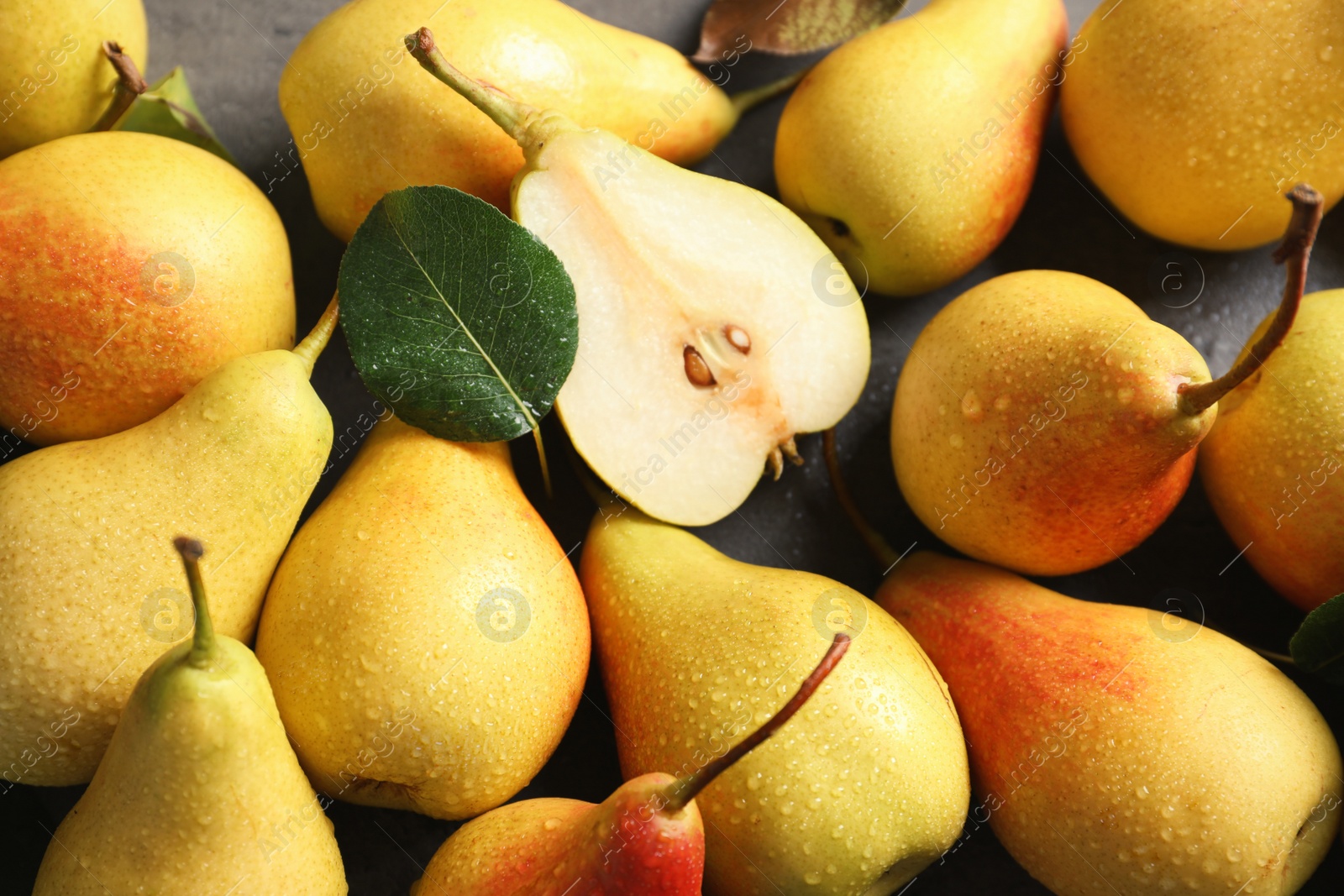 Photo of Many ripe pears on table, top view