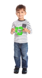 Photo of Little boy with recycling symbol on white background