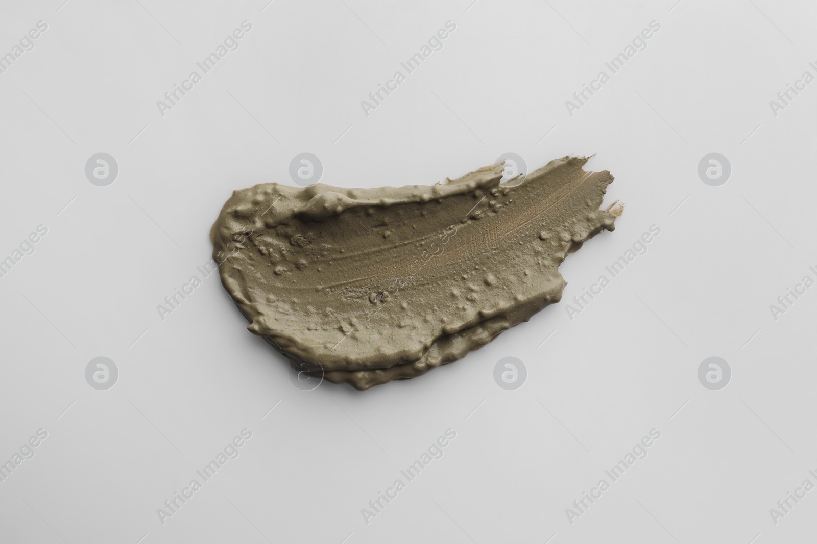 Photo of Sample of facial mask isolated on white, top view