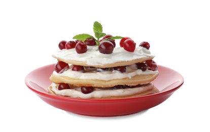 Plate with delicious pancakes on white background