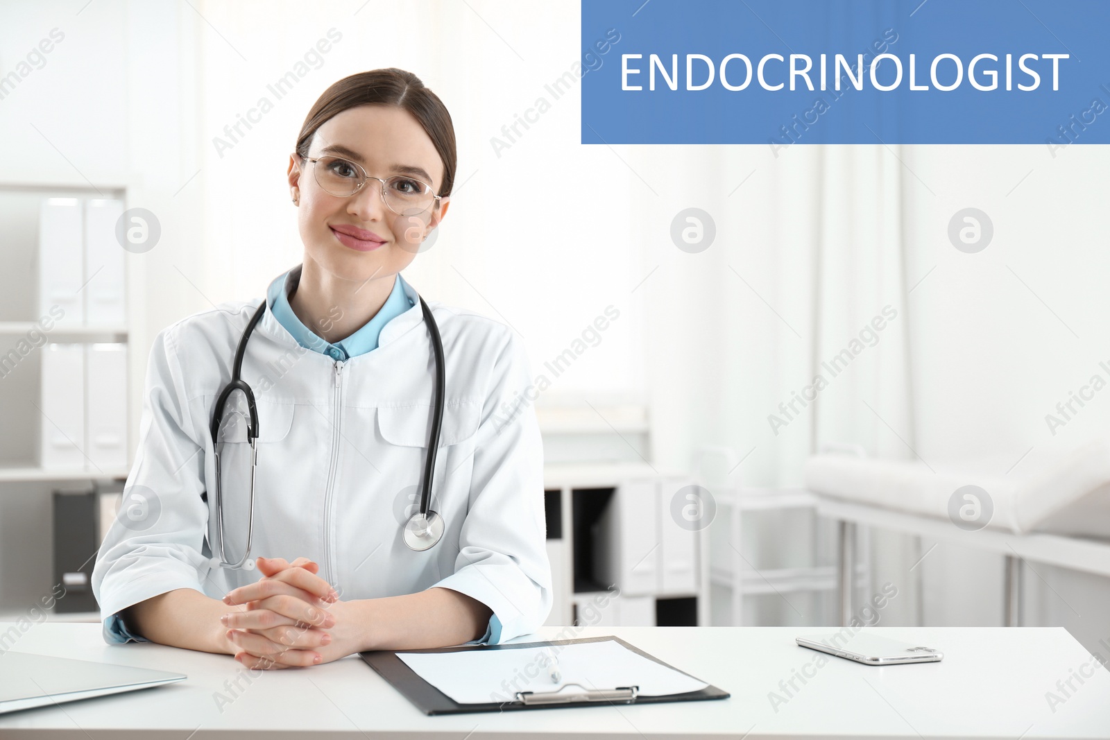 Image of Endocrinologist with stethoscope at white table indoors