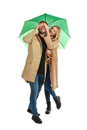 Full length portrait of beautiful couple with umbrella, isolated on white