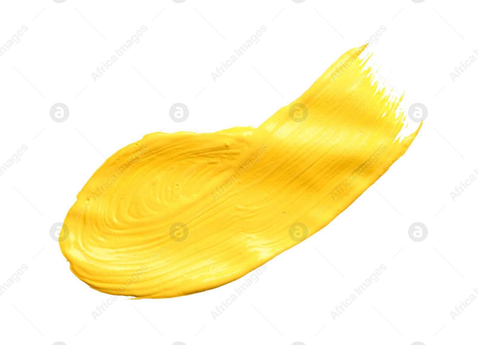 Photo of Abstract brushstroke of yellow paint isolated on white