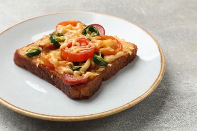 Photo of Tasty pizza toast on grey table, closeup
