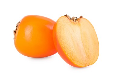 Photo of Whole and cut persimmon fruits isolated on white