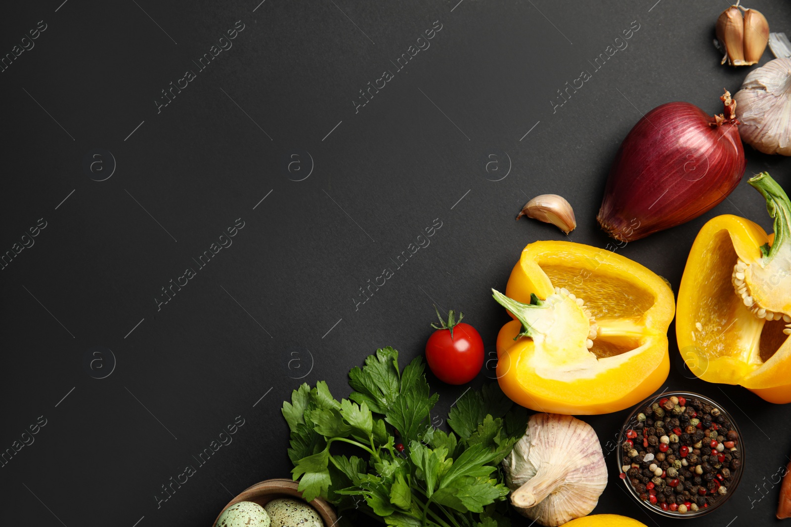 Photo of Flat lay composition with ingredients for cooking on black background. Space for text