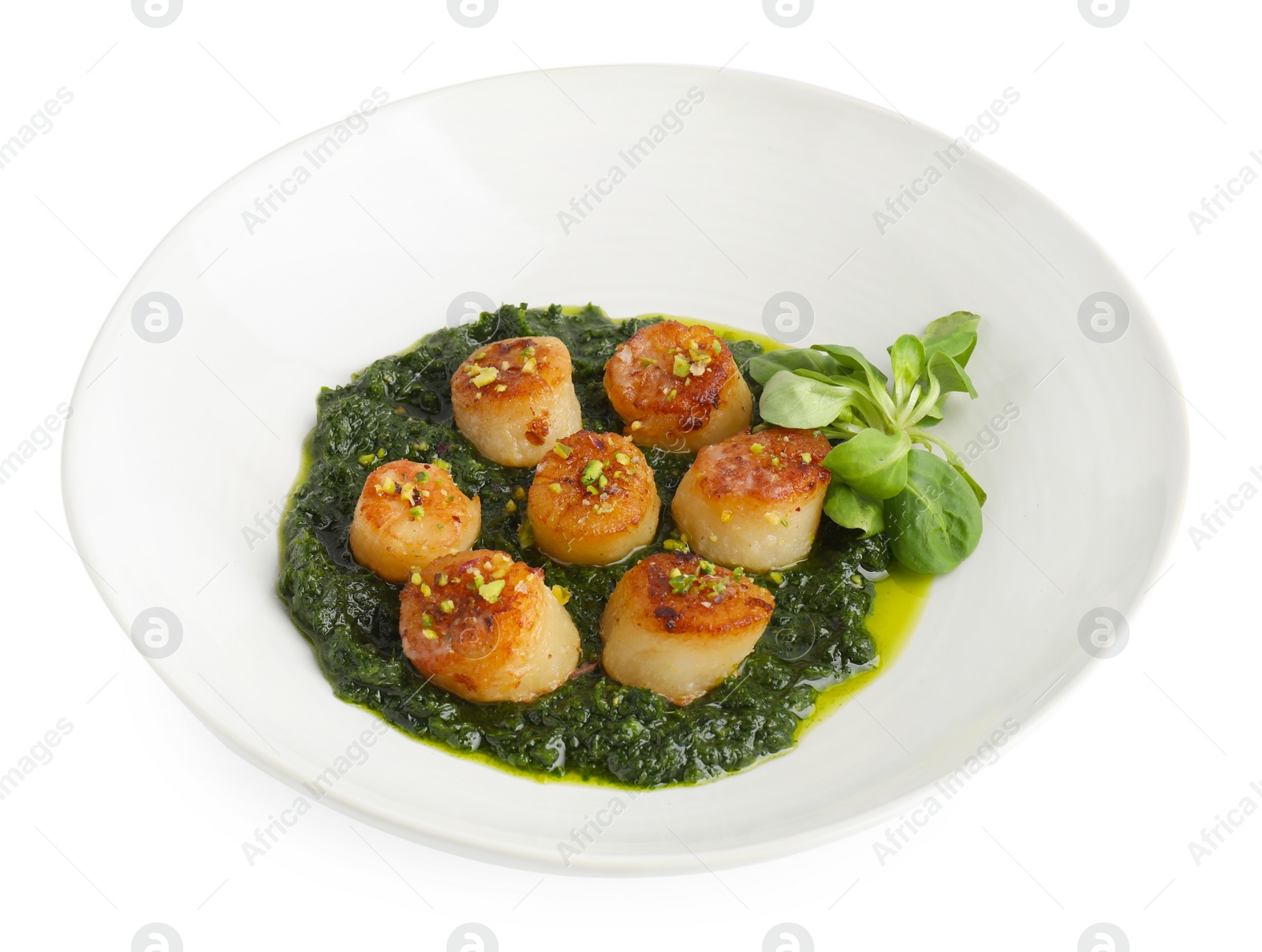 Photo of Delicious fried scallops with tasty sauce and corn salad in bowl isolated on white