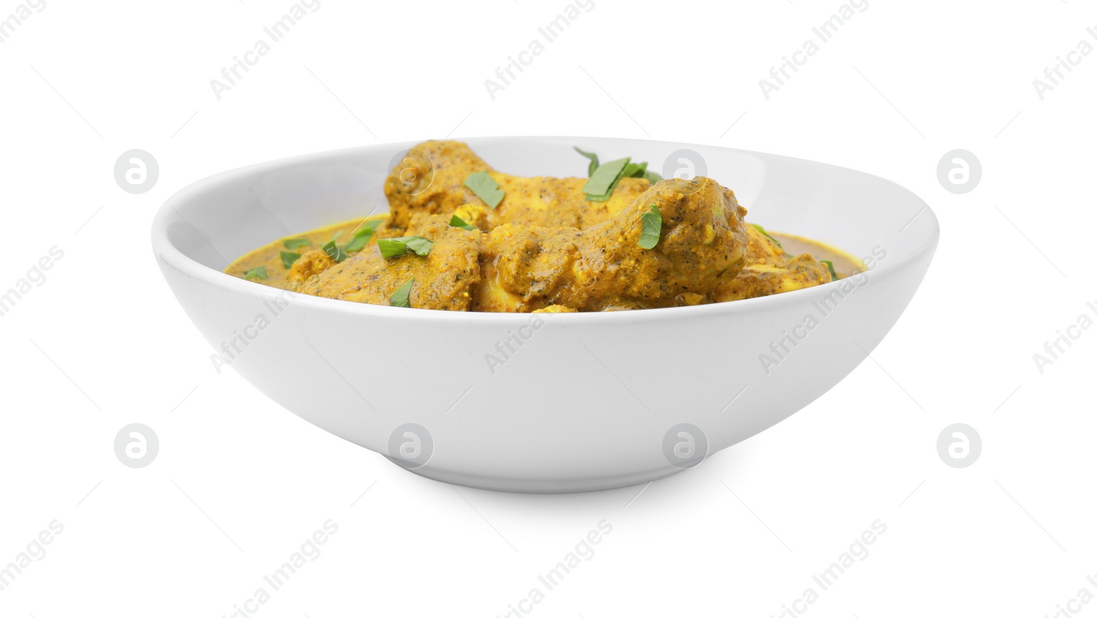 Photo of Delicious chicken with curry sauce and basil isolated on white