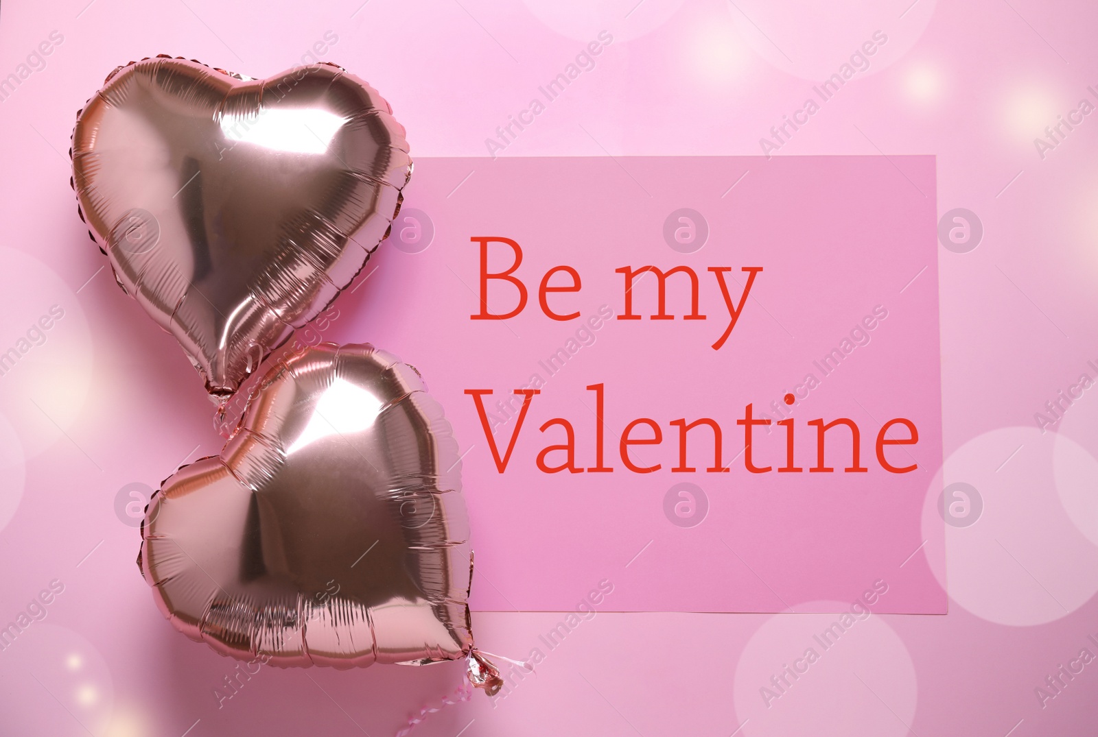 Image of Heart shaped balloons and card with text on pink background, flat lay. Valentine's day