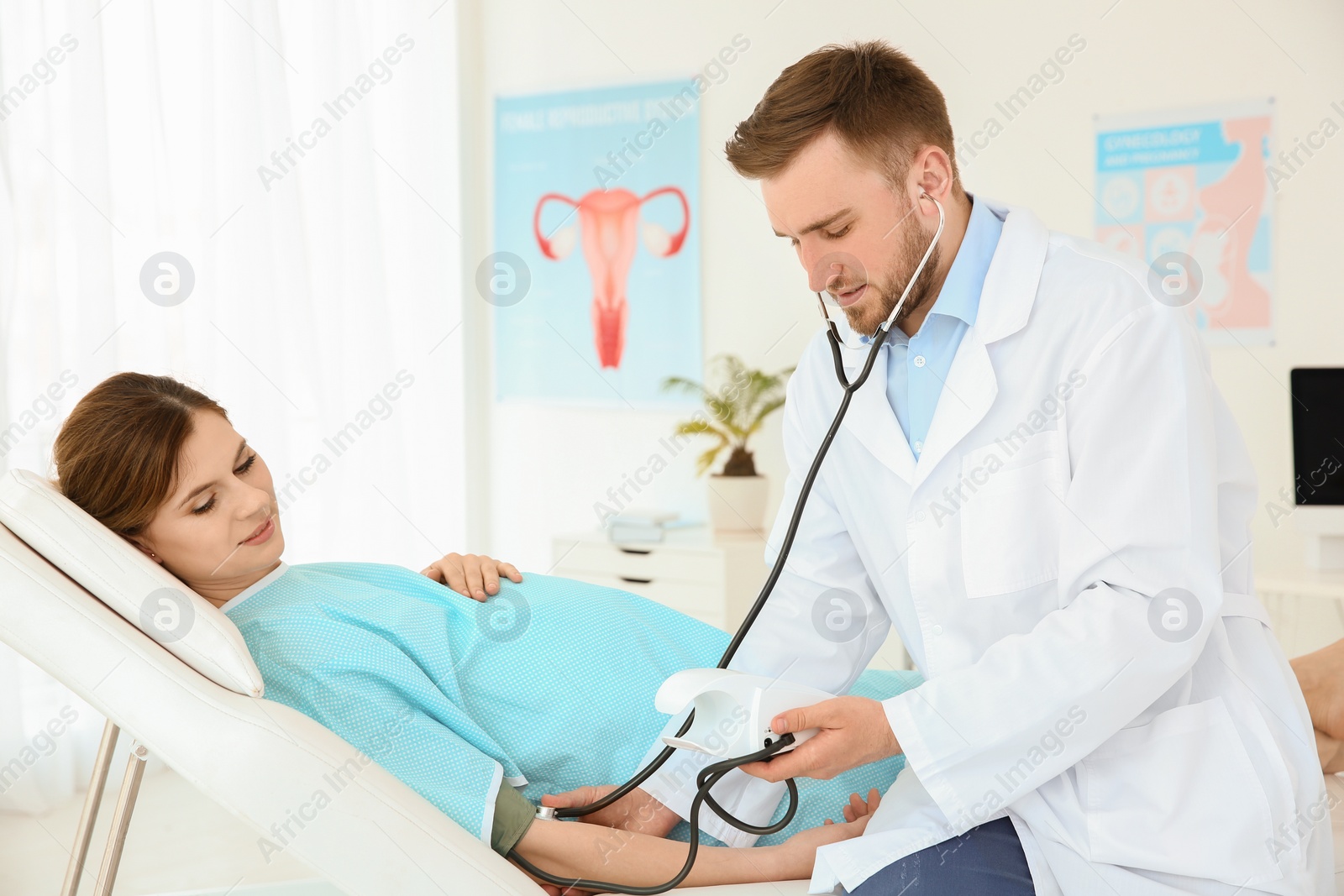 Photo of Gynecology consultation. Pregnant woman with her doctor in clinic