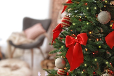 Photo of Christmas tree with stylish decor indoors, closeup