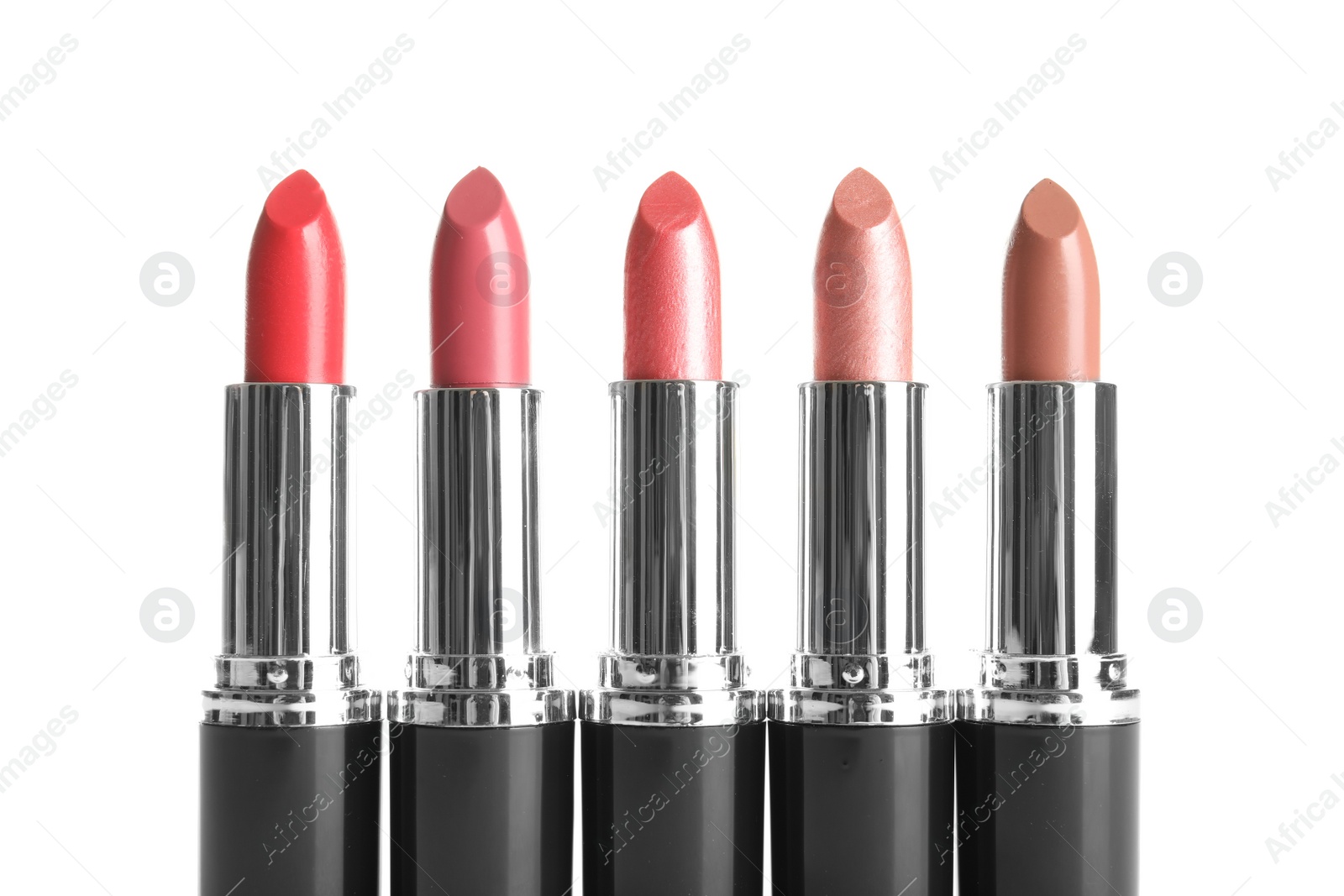 Photo of Different lipsticks on white background. Cosmetic product