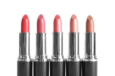 Different lipsticks on white background. Cosmetic product