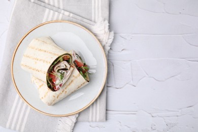 Delicious sandwich wraps with fresh vegetables on white textured table, top view. Space for text