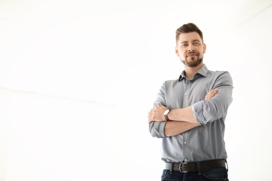 Photo of Male lawyer standing in light office