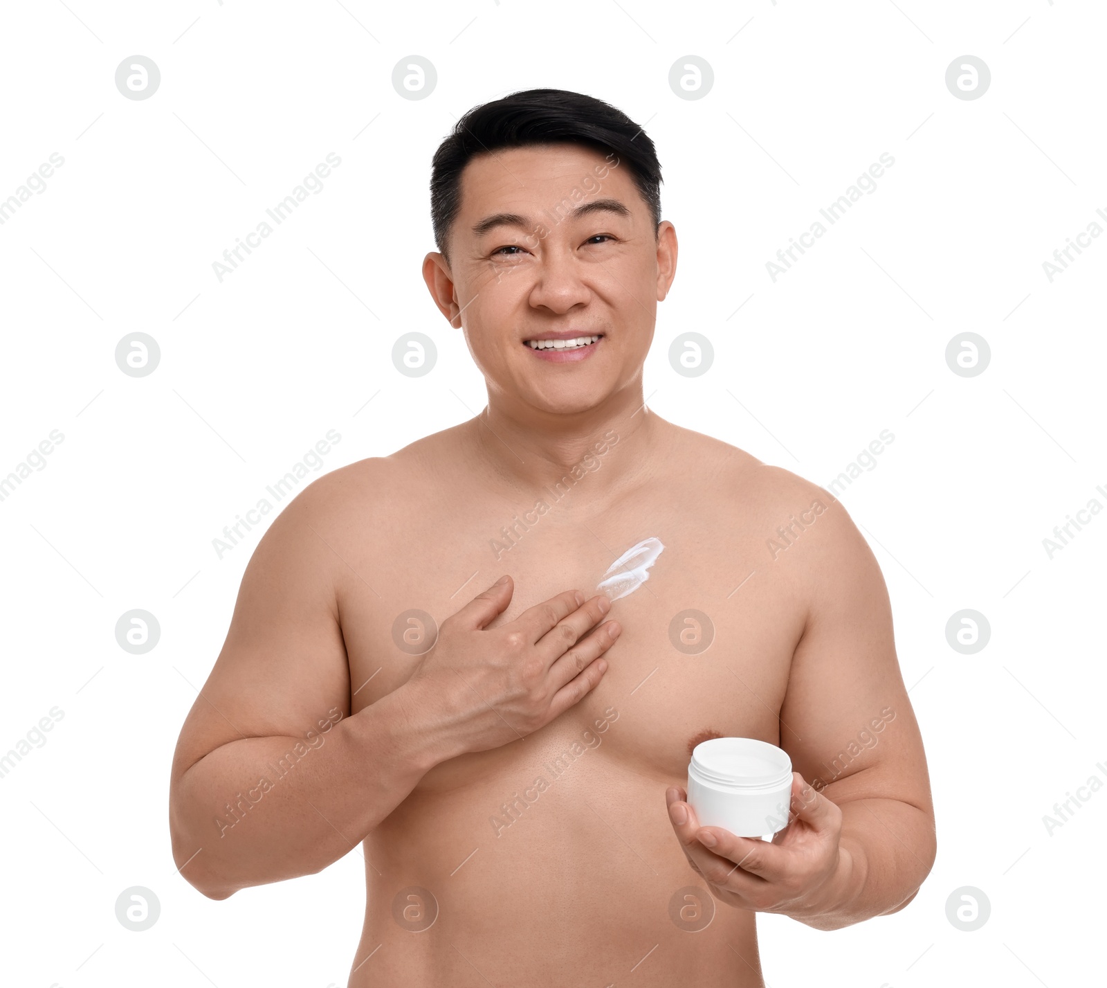 Photo of Handsome man applying body cream onto his chest on white background