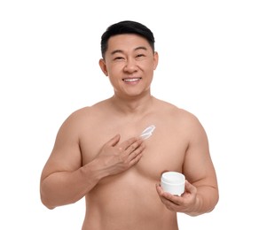 Handsome man applying body cream onto his chest on white background