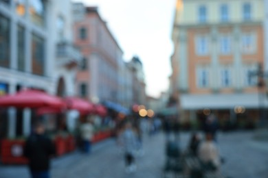 Blurred view of people walking on city street