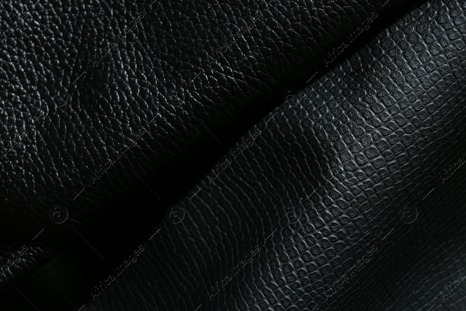 Photo of Black natural leather as background, top view