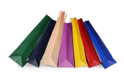 Photo of Colorful paper shopping bags isolated on white