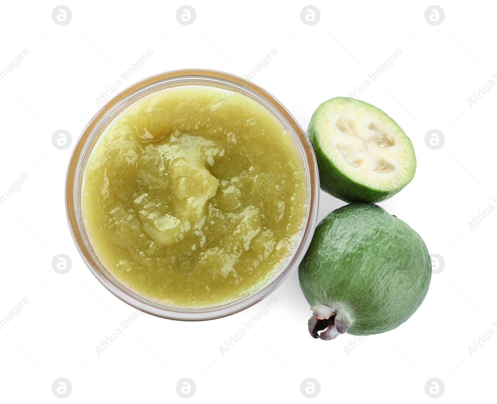 Photo of Feijoa jam in glass bowl and fresh fruits on white background, top view