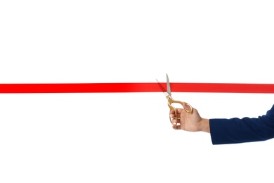 Photo of Man in office suit cutting red ribbon isolated on white, closeup