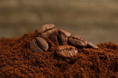 Pile of ground coffee with roasted beans, closeup