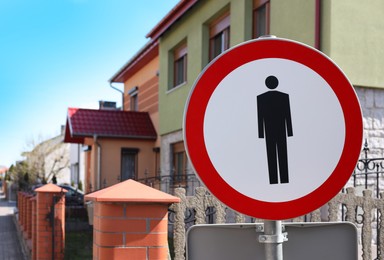 Photo of No Pedestrians sign outdoors on sunny day. Space for text