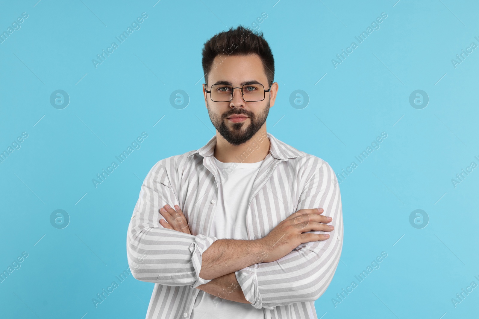 Photo of Handsome man wearing glasses on turquoise background